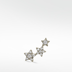 Left ear option of the 3-Star Diamond Stud, featuring a rising cluster of three stars paved with brilliant round diamonds.