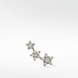The 3-Star Diamond Stud earring for the right ear, with three stars in a rising curve studded with brilliant diamonds.