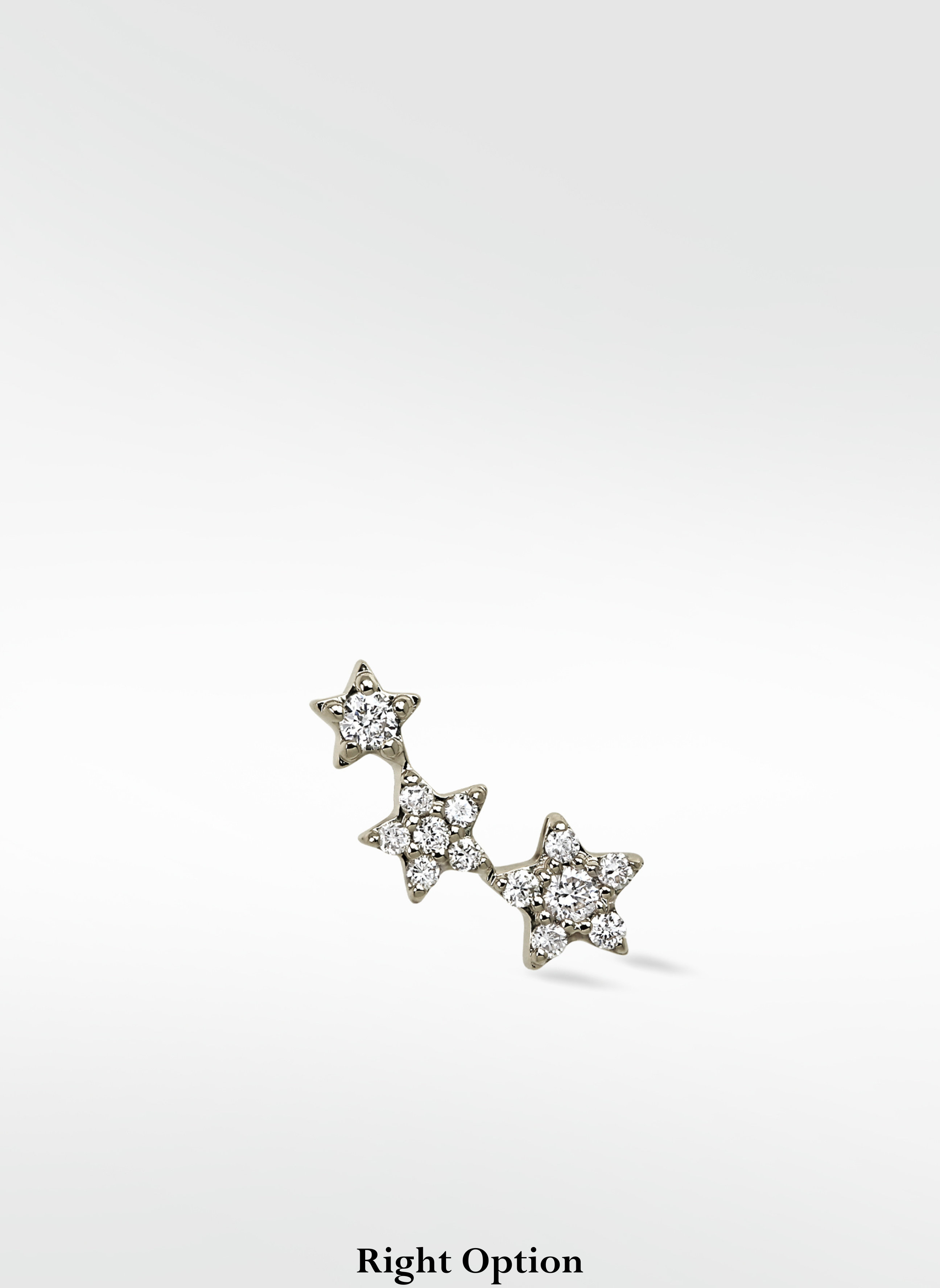 The 3-Star Diamond Stud earring for the right ear, with three stars in a rising curve studded with brilliant diamonds.