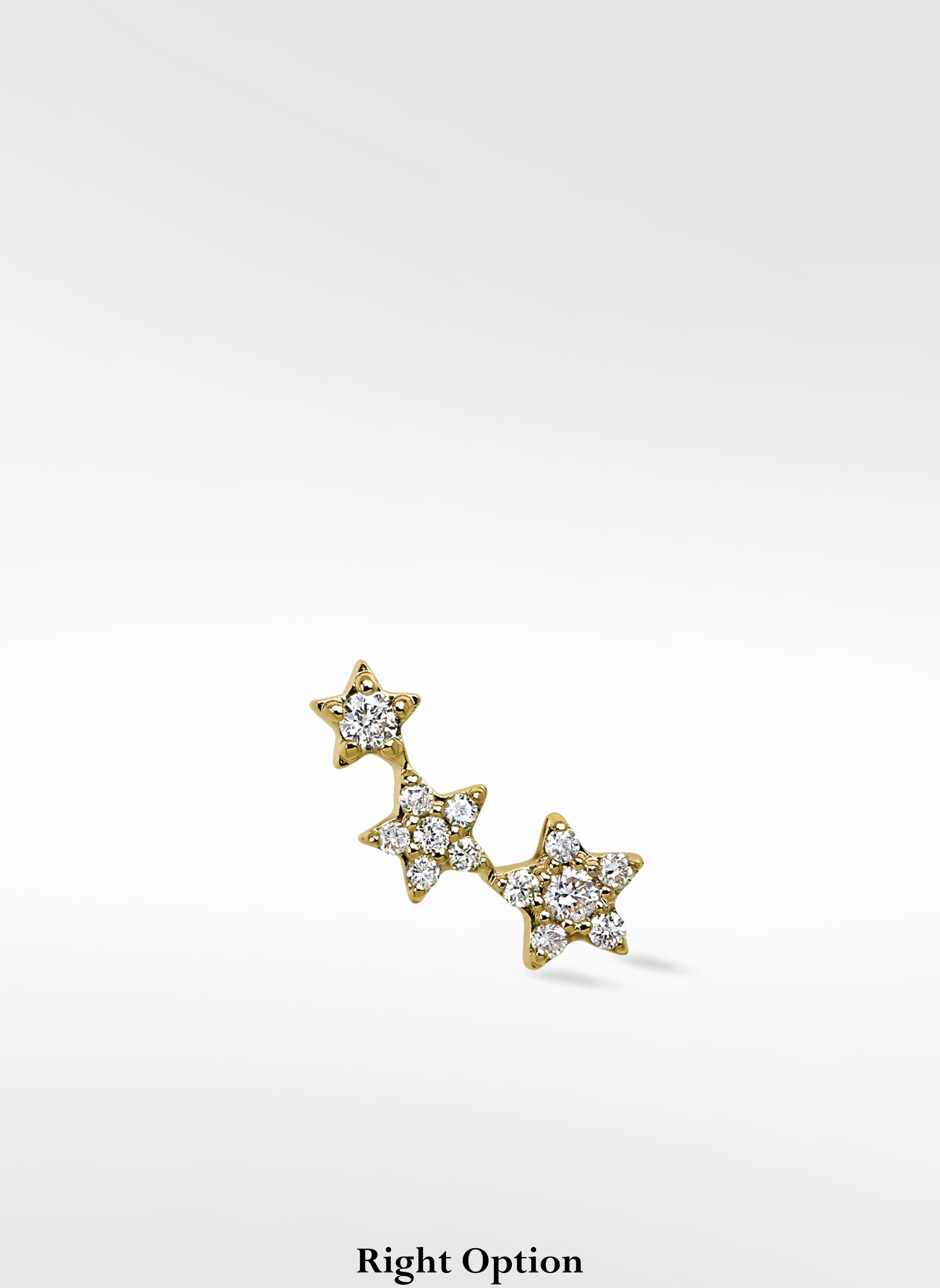 Right option of the 3-Star Diamond Stud, a yellow gold climber earring with three pavé diamond stars.