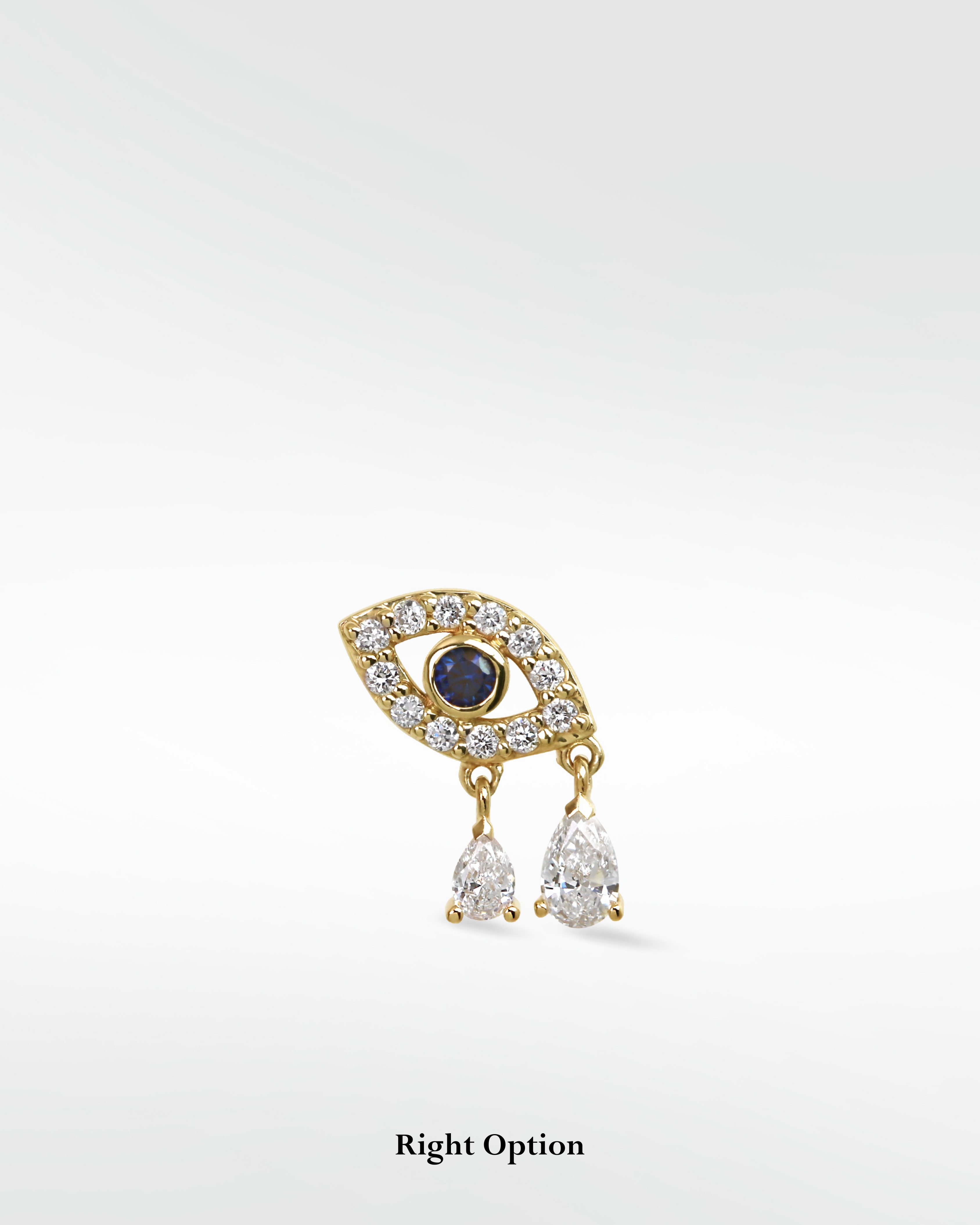 Right option for a 14k gold evil eye earring with a sapphire center and two dangling pear diamond drops.