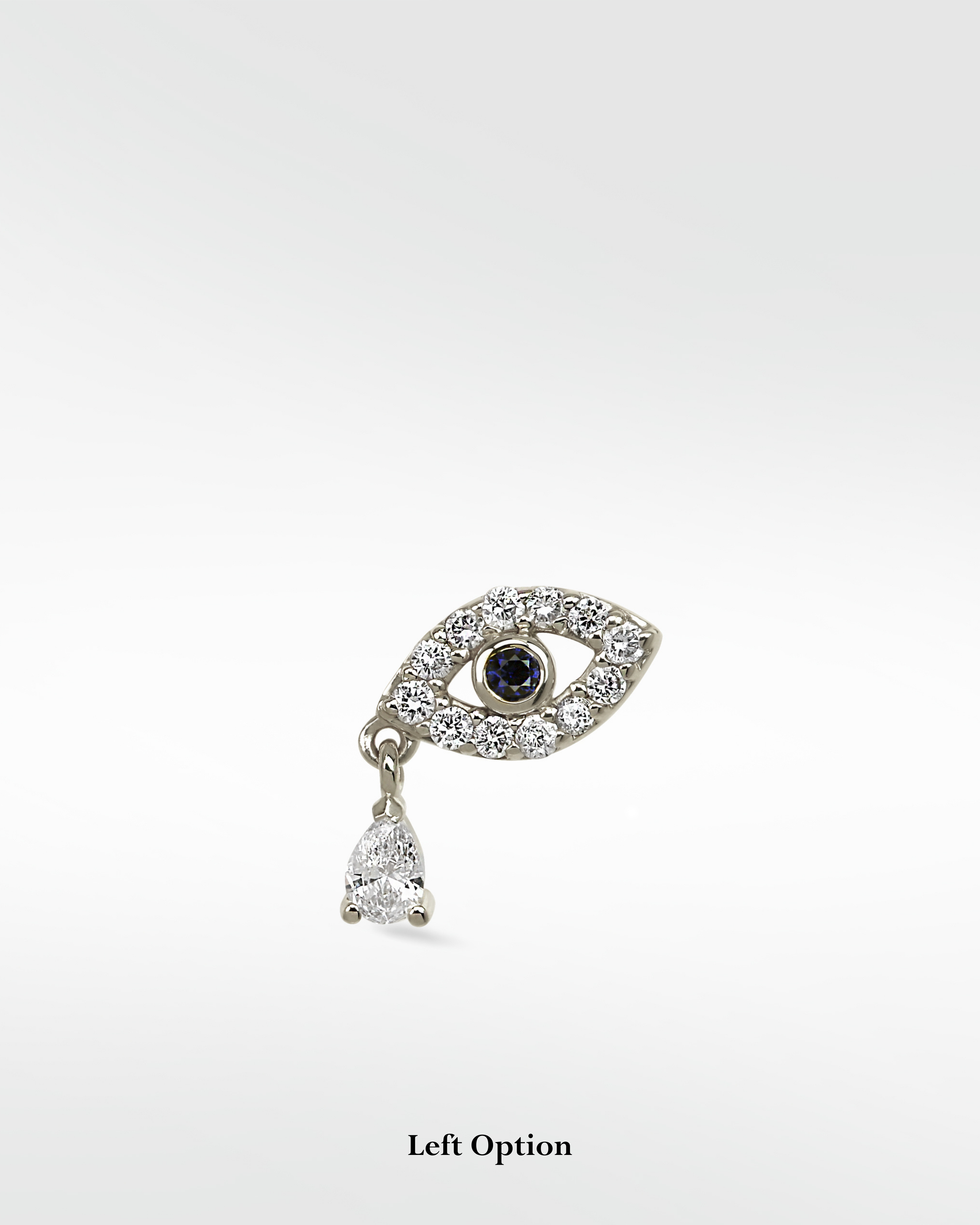 14k white gold Evil Eye earring with a blue sapphire pupil, pavé diamonds, and a dangling pear-cut diamond drop.