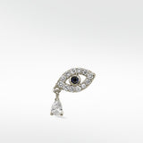 Lark & Berry Evil Eye stud in 14k white gold with a sapphire center, diamond pavé, and a pear-shaped diamond drop.