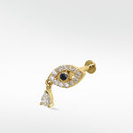 14k gold evil eye stud earring with a sapphire center, diamond pavé, and a dangling teardrop diamond against a white background.