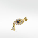 14k gold evil eye stud earring with a sapphire center, diamond pavé, and a dangling teardrop diamond against a white background.