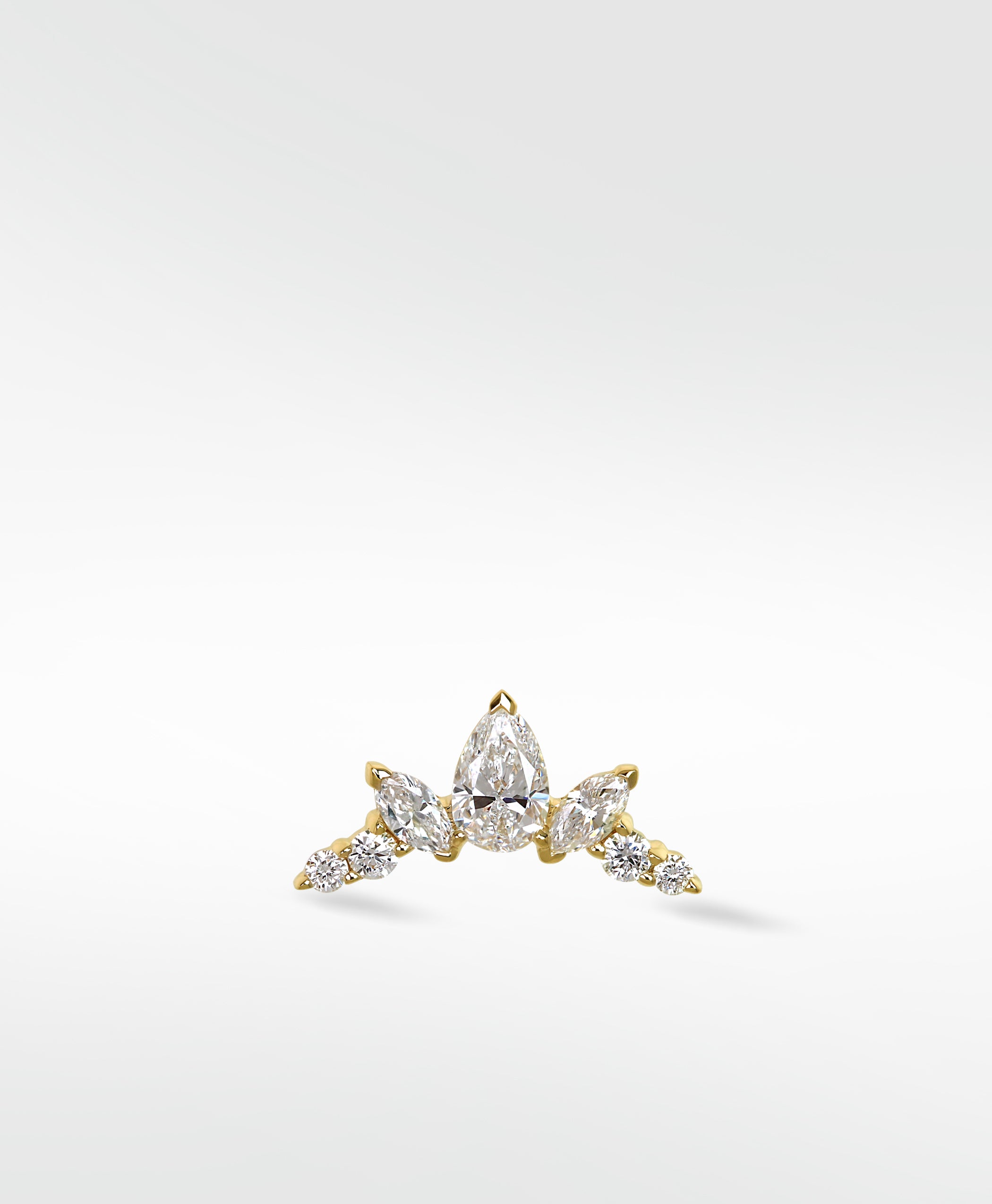 Lark & Berry's Crown Crawler earring in yellow gold with pear, marquise, and round cut diamonds, shown on a white background.
