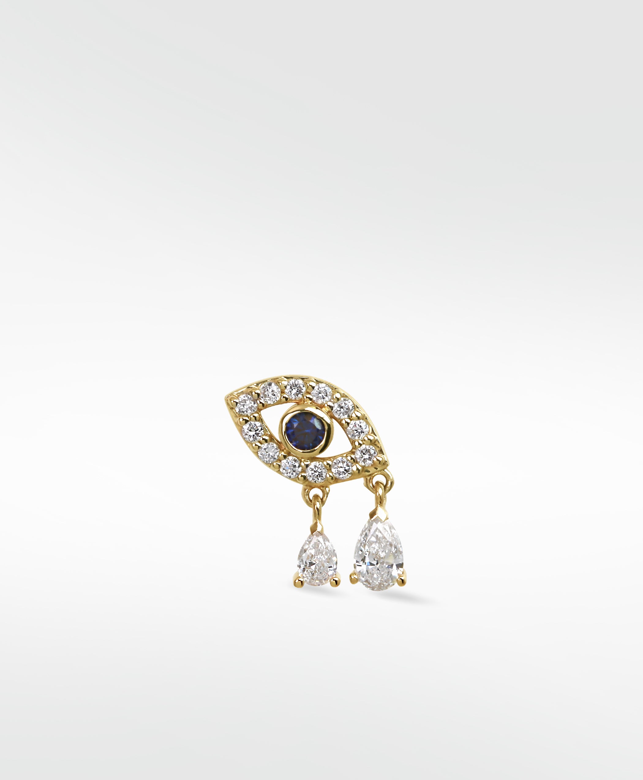 14k gold evil eye stud earring with a blue sapphire, diamond pavé, and two dangling pear-cut diamond drops.