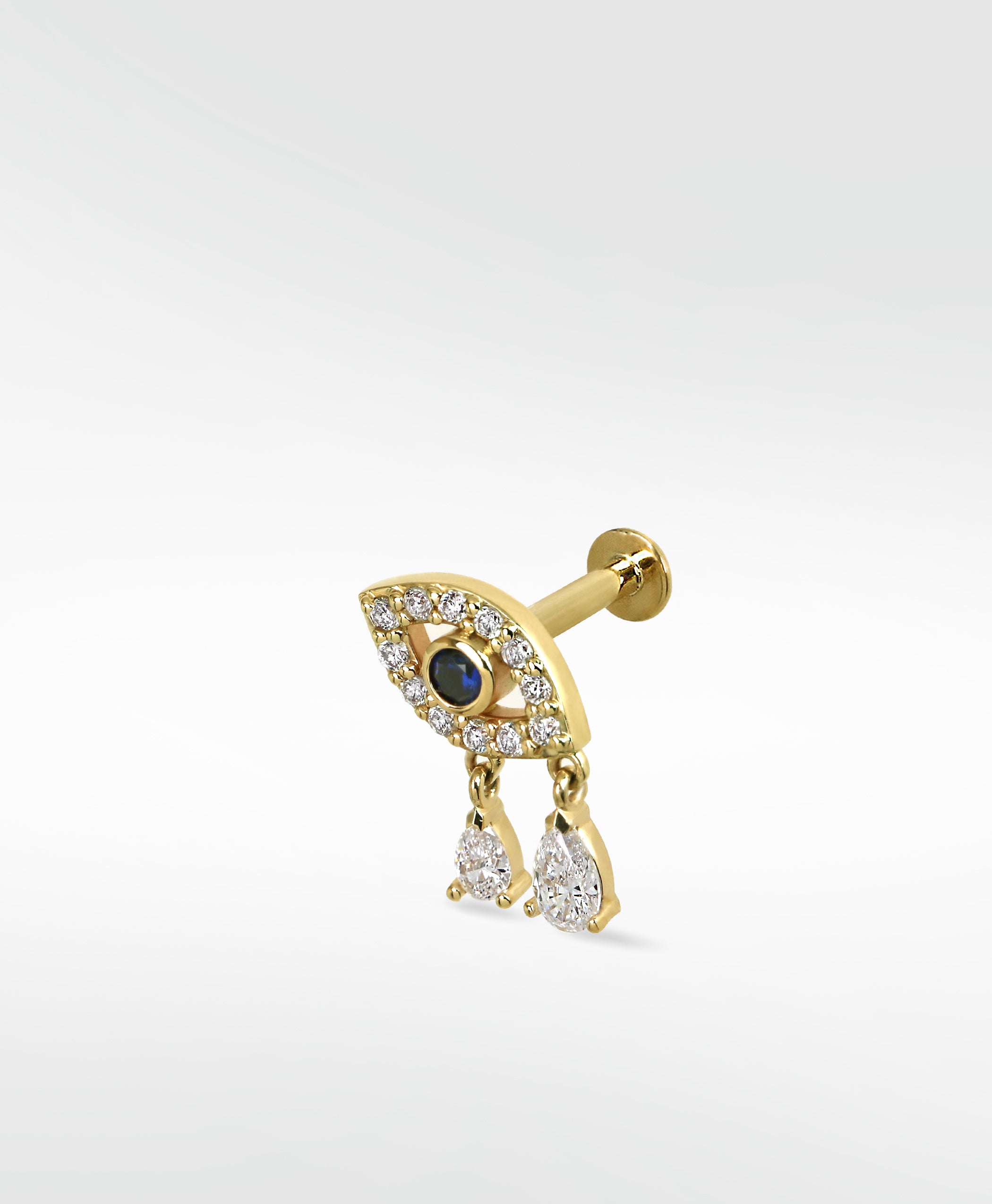 Lark & Berry 14k gold evil eye stud earring with a sapphire center and two dangling diamond drops.