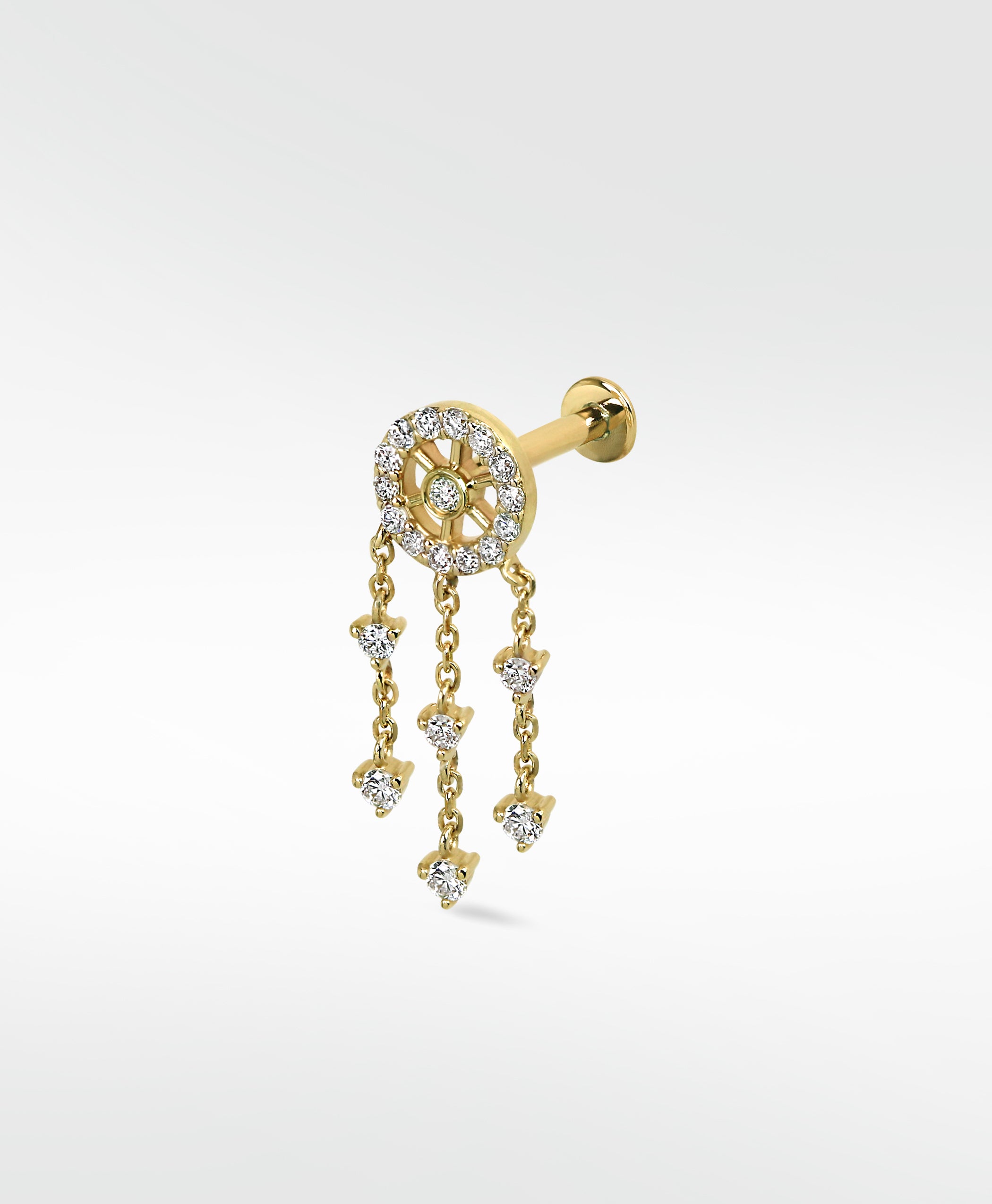 A yellow gold Dreamcatcher Diamond Drop labret earring with dangling chains on a white background.