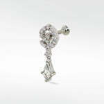 Celestial Swirl diamond stud in 14k white gold with a pavé swirl top and a dangling kite-shaped diamond.