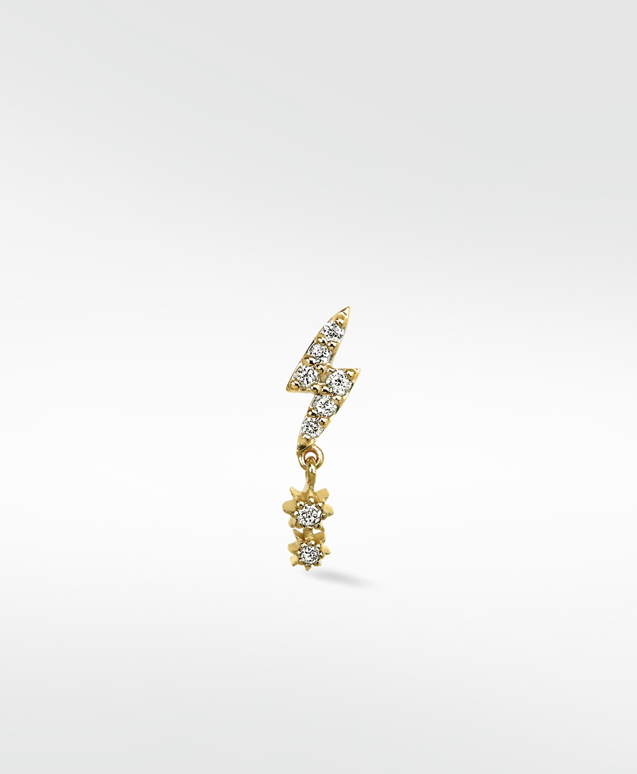 Lark & Berry Lightening Bolt earring in yellow gold with pave diamonds and a dangling diamond star drop.
