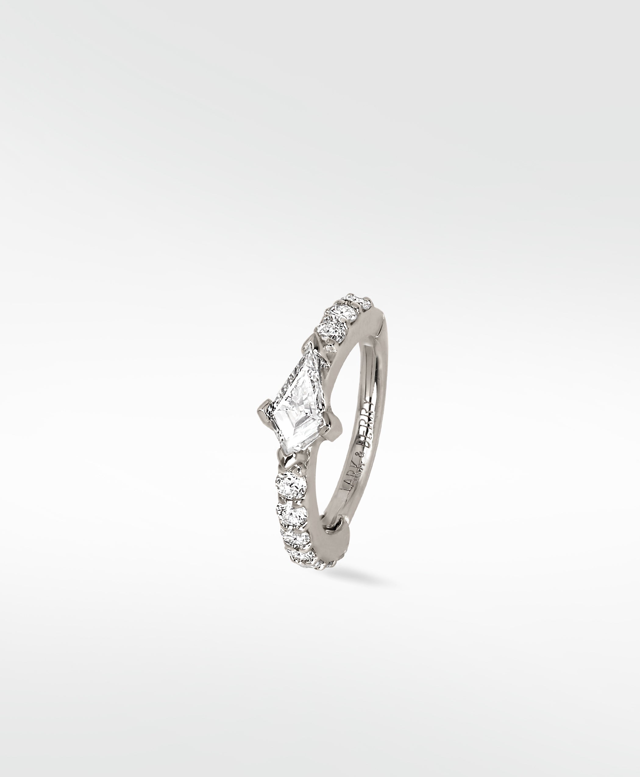 Modernist Kite Diamond Hoop earring in 14k white gold with a central kite-cut diamond and brilliant cut pavé diamonds.