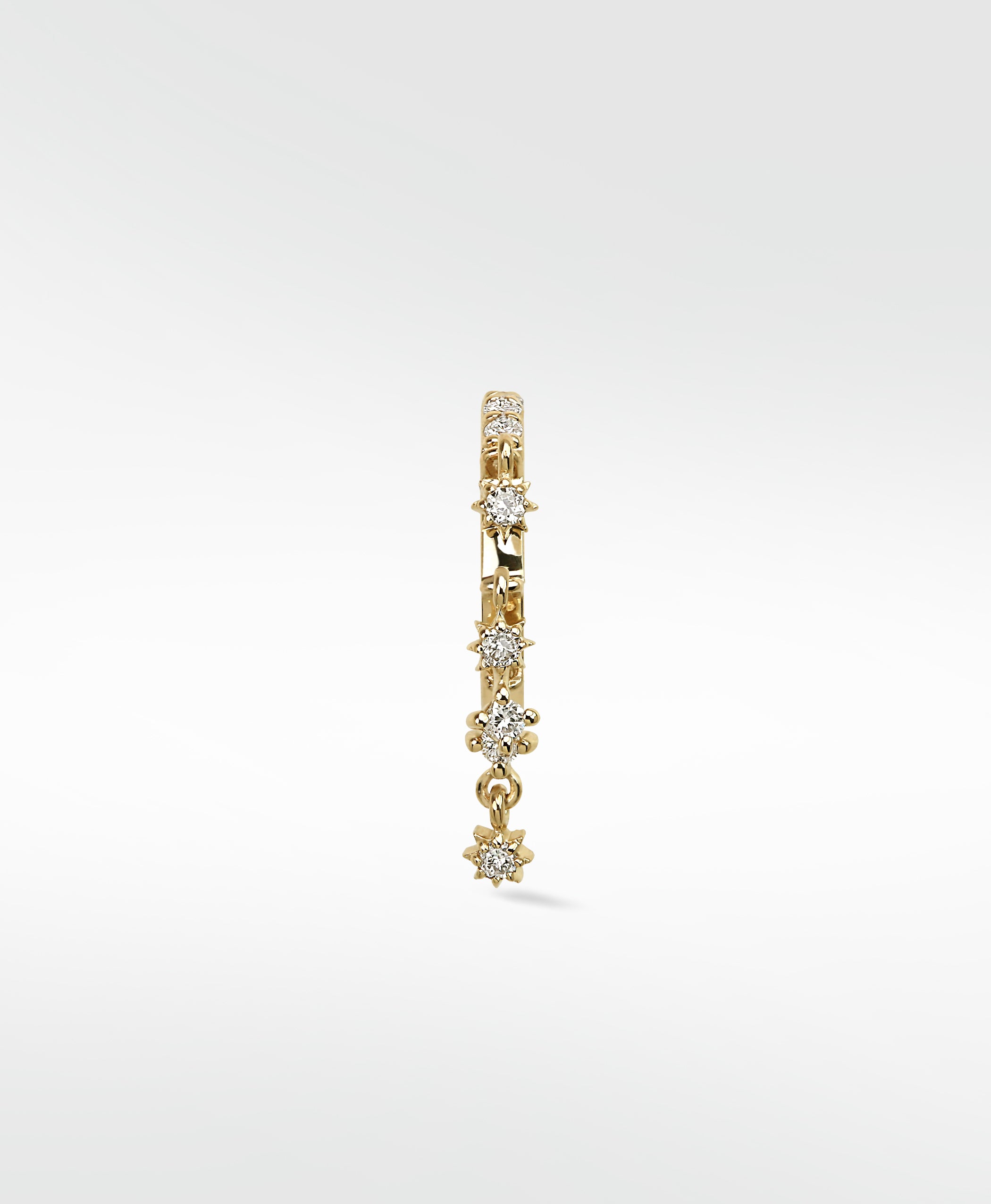A Lark & Berry Modernist Celestial Drop Hoop in gold, with diamonds in star settings and a matching drop charm, on a white background.
