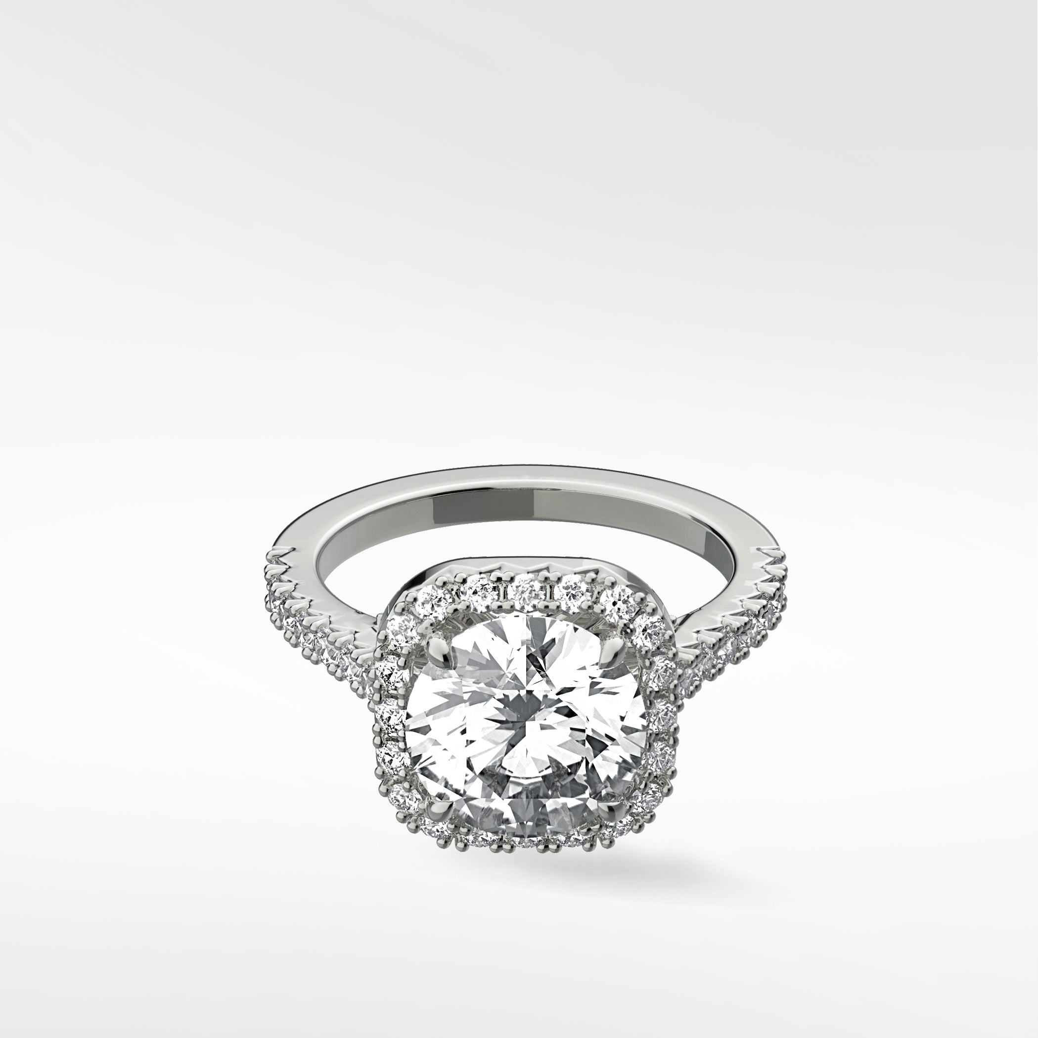 The platinum Sequoia Diamond Engagement Ring featuring a brilliant center diamond in a classic pavé halo setting.