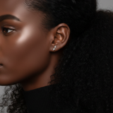Close-up of a model wearing the Lark & Berry Double Diamond Kite Stud earring, highlighting its placement on the ear.